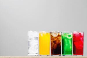 Soft drinks and fruit juice mixed with soda high in sugar have a negative effect on physical health photo