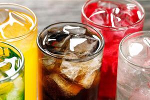 Soft drinks and fruit juice mixed with soda high in sugar have a negative effect on physical health photo