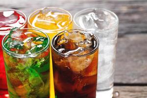Soft drinks and fruit juice mixed with soda high in sugar have a negative effect on physical health photo
