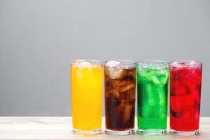Soft drinks and fruit juice mixed with soda high in sugar have a negative effect on physical health photo