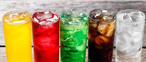Soft drinks and fruit juice mixed with soda high in sugar have a negative effect on physical health photo