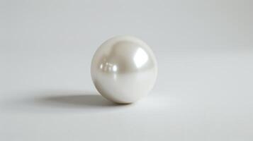 A Single Pearl Glistens on a White Background photo