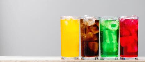 Soft drinks and fruit juice mixed with soda high in sugar have a negative effect on physical health photo