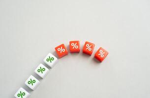 The growth of interest rates stops and the fall begins. Burst the financial bubble. Economic slowdown. Over-indebtedness. Debt restructuring. Avoid bankruptcy. photo