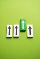 Green arrow exits the row. Best option. Promotion and improvement. Right choice. Growth driver. Improvement and upgrade. Skills and abilities. Economic indicators and indices. photo