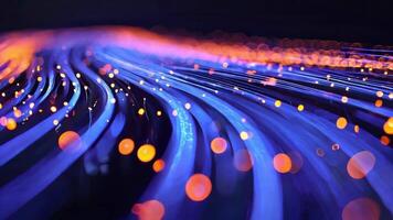 Abstract motion blur of vibrant blue and orange lights creating a dynamic wave pattern, evoking energy and innovation. video