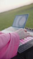 Hand Pressing Buttons on Music Controller with Pink Backlighting video