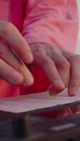 hands pressing buttons on music controller with pink backlight video