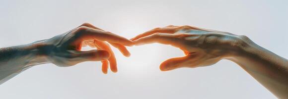 Two hands reaching towards each other in a soft light. Concept of human connection, support, unity, and empathy photo