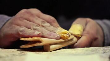Artisan woodworking in a workshop, Man crafting decorative door, Man working with tools, Showing hard work and skills. High quality 4k footage video