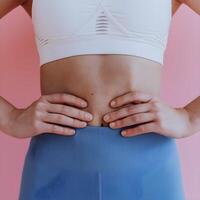 Person in white sports bra and leggings with hands on hips For Social Media Post Size photo