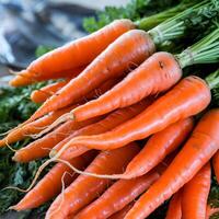 Bundled fresh carrots with vibrant orange color and green stems on a blurred background For Social Media Post Size photo