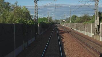 First-person perspective of railway tracks from a moving train. The image emphasizes motion and journey, capturing the essence of travel, exploration. Perfect for travel-related content. video