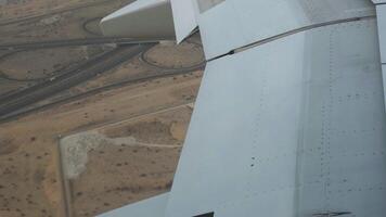 Slow motion montage of an airplane wing extending its flaps for landing. video