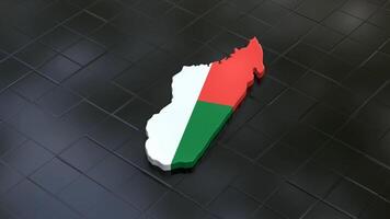 3D map of Madagascar moving on a black textured floor. The country's area features the Madagascar flag texture with a luma matte effect. 3d rendering video