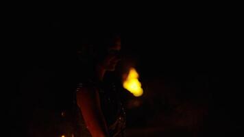 Amazonian Holding Burning Fire Torches In Hands And Rotating, Medium Portrait In Darkness video