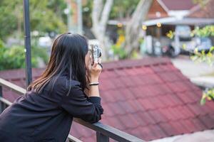 A woman taking a photo with a camera