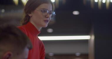 A diverse group of entrepreneurs engages in a dynamic business meeting within a modern office, showcasing their collaborative spirit and innovative approach to business development video
