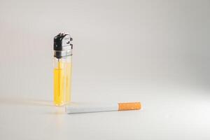 Lighter and Cigarette on a Soft Background photo