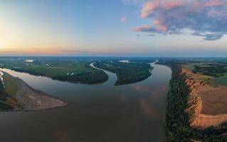 Aerial drone view of river landscape in sunny summer evening photo