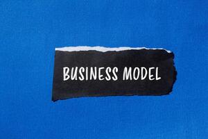 Business model concept on blue background photo