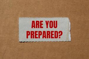 Are you prepared question message written on ripped torn paper piece with cardboard background. Conceptual are you prepared question symbol. Copy space. photo