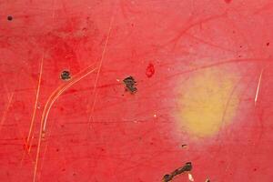 A red surface with a yellow object on it photo