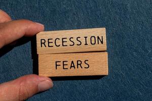 Recession fears message written on wooden blocks on gray felt background. Conceptual recession fears symbol. Copy space. photo