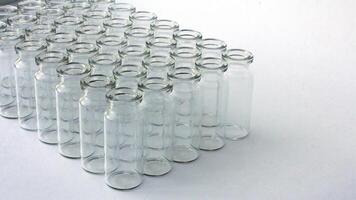 New glass vials for instrumental analysis on a white background. analytical vials prepared for chemical analysis photo