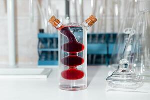 Glass combination container designed for mixing multi-colored liquids photo