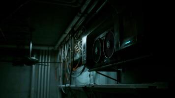 A computer on a wall in a dimly lit room video