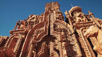 A towering building adorned with intricate statues on its walls video