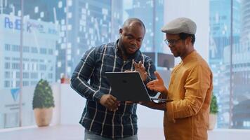 Entrepreneurs sharing their workspace vision with the broker, evaluating architectural blueprints for a new office space in high class urban building. Potential investment in property. Camera B. photo