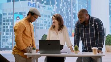 Business professionals and a real estate agent engage in a planning session, discussing the layout and design of a new office space based on detailed blueprints. Property investment. Camera A. photo
