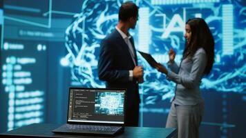 Focus on laptop in workspace used by AI researchers working with artificial intelligence in blurry background. Close up of notebook used by employees developing AI systems in tech startup, camera A photo