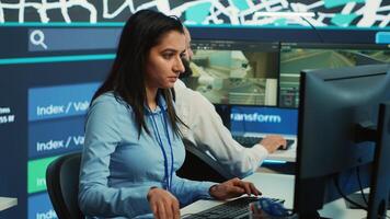 Indian employee collecting and transmitting information to couriers, locating the destination and sending the gps coordinates for faster order delivery. Dispatch call center operator. Camera A. photo