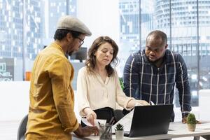 Entrepreneur engage in a planning session with a real estate agent on office tour, evaluating architectural blueprints and strategizing the layout of a new modern workspace for leasing. photo