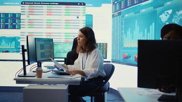 Business specialist reviewing key performance indicators within the firm activity. Conducting evaluations in order to help with global corporation expansion, enhance team efficiency. Camera B. photo