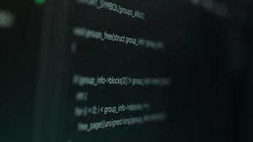 Extreme close up shot of hacking code running on computer system monitors attacking firewalls. Programming scripts shown on PC screen used by cyber criminals to breach security photo