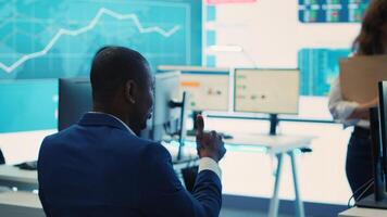 Executive consultant gathers his staff to discuss about performance metrics, looking for ways to improve the workflow in order to achieve business goals and expand on global scale. Camera A. photo