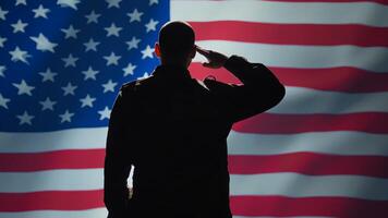 American soldier doing saluting hand gesture towards USA flag in command center, showing respect. Military unit in uniform serving in United States Armed Forces, doing patriotic gesturing, camera B photo