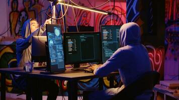 Hackers using network vulnerabilities to exploit servers, doing coordinated cyber attacks, trying to break computer systems at night. Cybercriminals work together on breaching networks photo