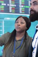 General manager and CEO sharing insight about a new development strategy with data on a big screen, presenting annual infographics to analyze business activity status. Investors team. photo