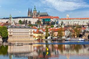 View of Charles bridge over Vltava river and Gradchany photo