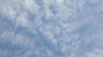 Blue sky background with tiny clouds, Nature cloud blue sky background, Blue Sky with Fluffy White Clouds on a Sunny Summer Day photo