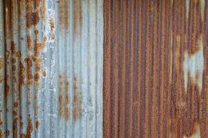 Old galvanized sheet background with rust pattern. Used for decorating the walls of restaurants, coffee shops, vintage style, cowboy style, backdrop. photo