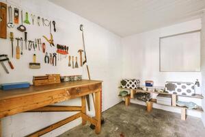 A garage with a workbench and tools on it photo
