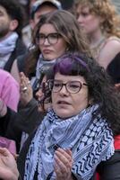 A Woman In The Crowd Protesting At The Student Demonstration Free Palestinian At The UVA University Amsterdam The Netherlands 7-5-2024 photo