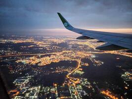 A snapshot of the city at night from the height of the plane's flight photo