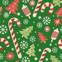 A christmas pattern with candy canes and snowflakes vector